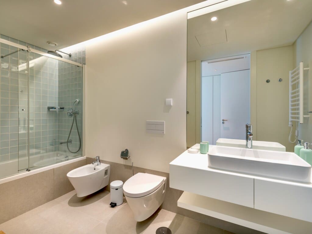 bliss & spa bathroom at Bayline, Armação de Pêra: bathtub with glass screen, vessel basin, toilet and bidet