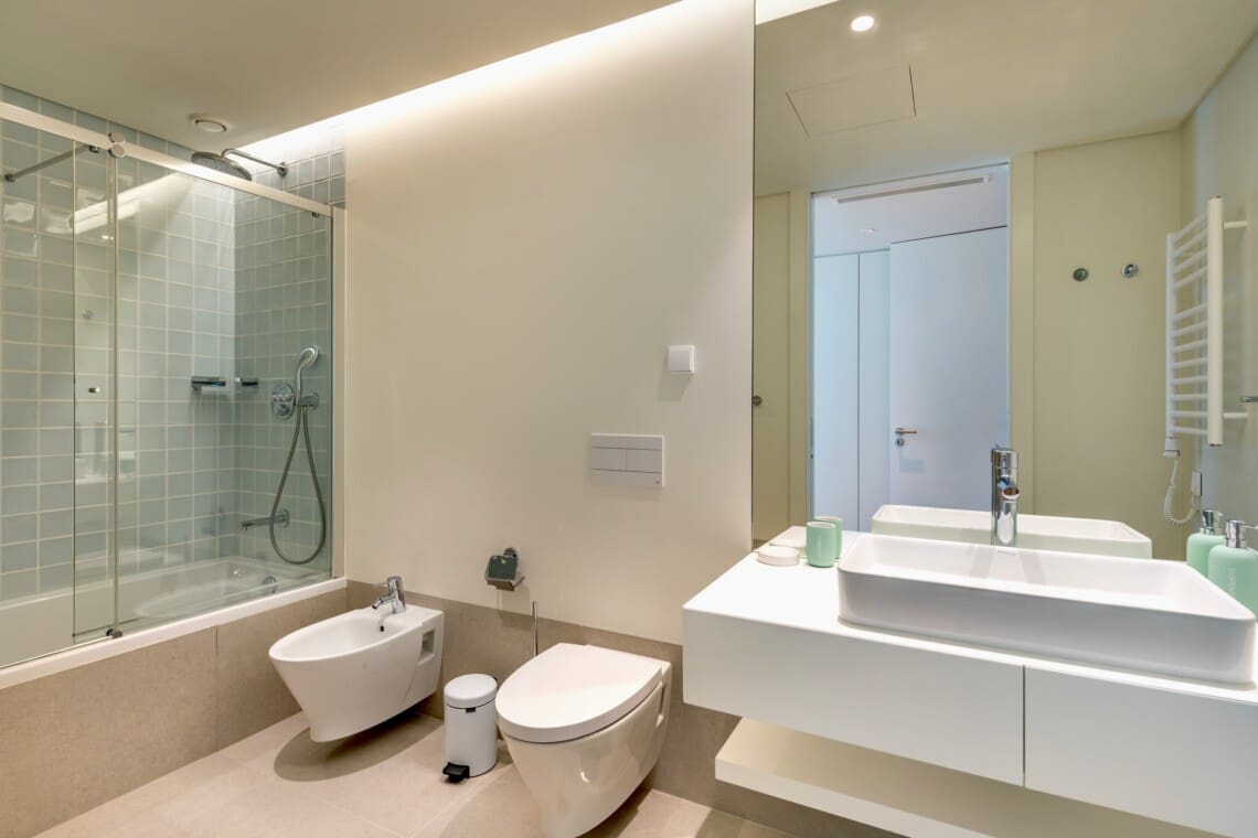 bliss & spa bathroom at Bayline, Armação de Pêra: bathtub with glass screen, vessel basin, toilet and bidet