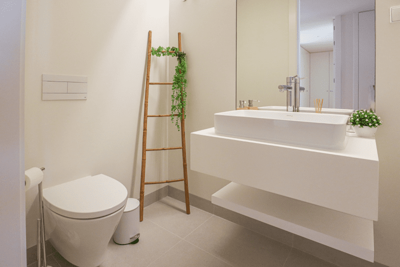 Salmão bathroom at Bayline, Armação de Pêra: vessel basin on a floating shelf and wall-hung toilet