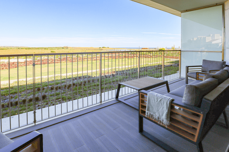 Cavala balcony at Bayline, Armação de Pêra: outdoor sofa and coffee table overlooking open countryside