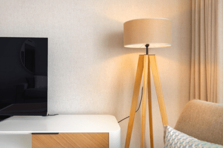 Pargo A living room at Bayline, Armação de Pêra: tripod floor lamp beside the TV unit
