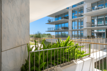 Linguado balcony at Bayline, Armação de Pêra: planted balcony with a view of the neighbouring blocks and trees