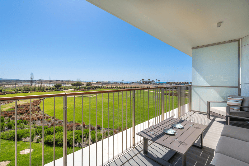 Enguia balcony at Bayline, Armação de Pêra: outdoor lounge set overlooking the gardens