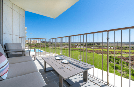 Enguia balcony at Bayline, Armação de Pêra: outdoor sofa and table overlooking the gardens and pool
