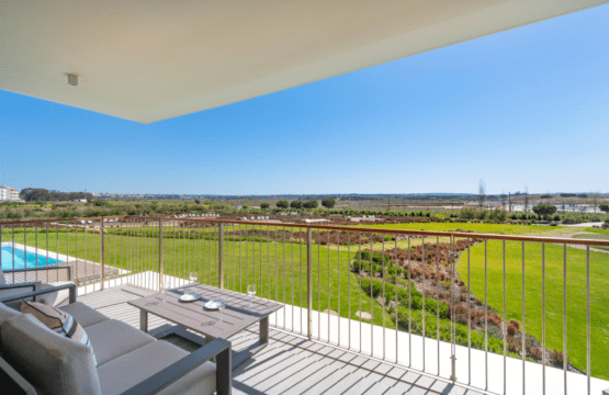 Enguia balcony at Bayline, Armação de Pêra: lounge set with a wide view over the pool and gardens