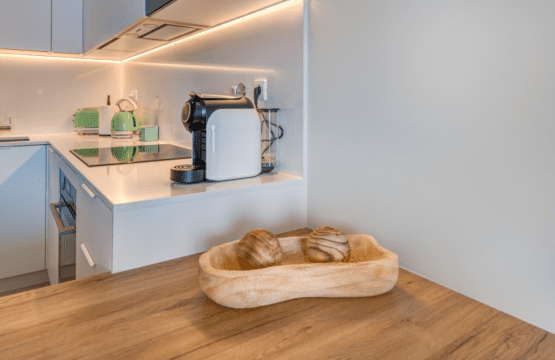 Corvina kitchen at Bayline, Armação de Pêra: white fitted kitchen with induction hob and coffee machine
