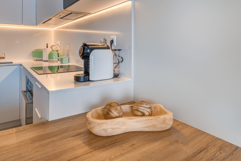 Corvina kitchen at Bayline, Armação de Pêra: white fitted kitchen with induction hob and coffee machine