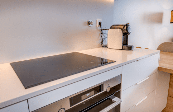 Corvina kitchen at Bayline, Armação de Pêra: induction hob, built-in oven and coffee machine