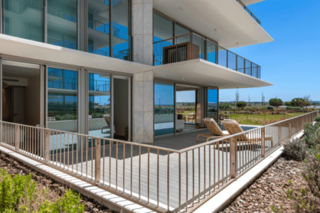 Sardinha terrace at Bayline, Armação de Pêra: wraparound ground-floor terrace with sun loungers beside the gardens