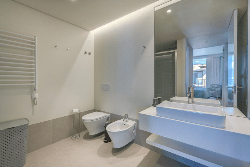 Liro bathroom at Bayline, Armação de Pêra: vessel basin, wall-hung toilet, bidet and heated towel rail