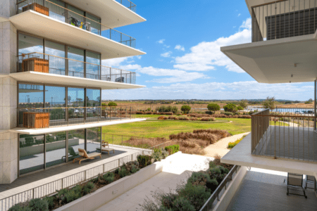 Bayline condominium in Armação de Pêra: apartment blocks with wide balconies above the gardens, seen from a balcony