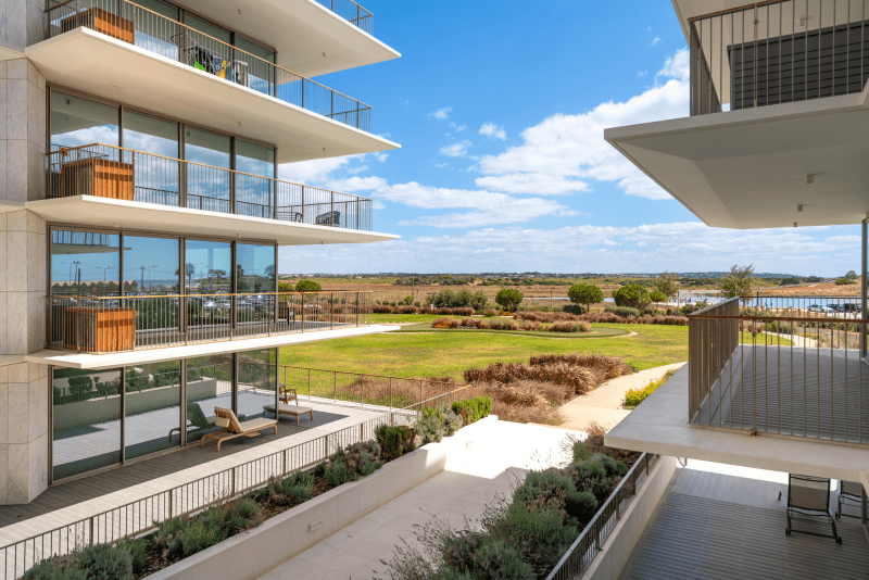 Bayline condominium in Armação de Pêra: apartment blocks with wide balconies above the gardens, seen from a balcony