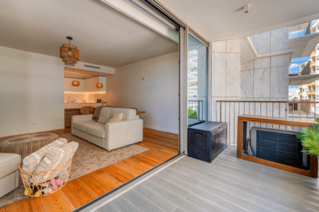 Faneca at Bayline, Armação de Pêra: living room seen from the balcony through open sliding doors