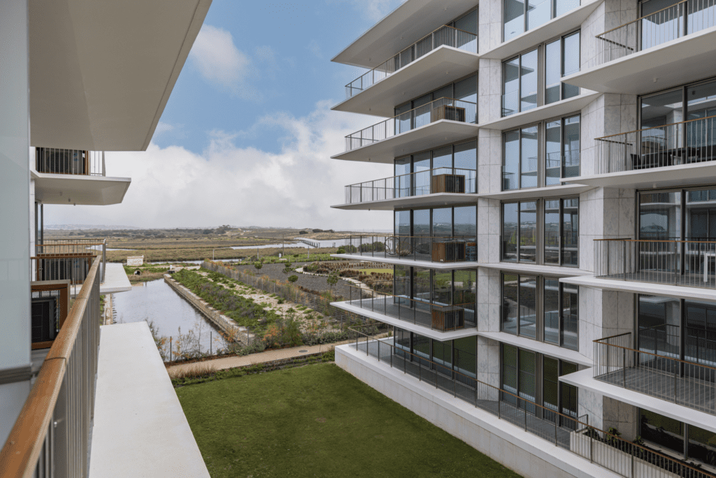 Bayline condominium in Armação de Pêra: apartment blocks, lawn and lagoon seen from a balcony